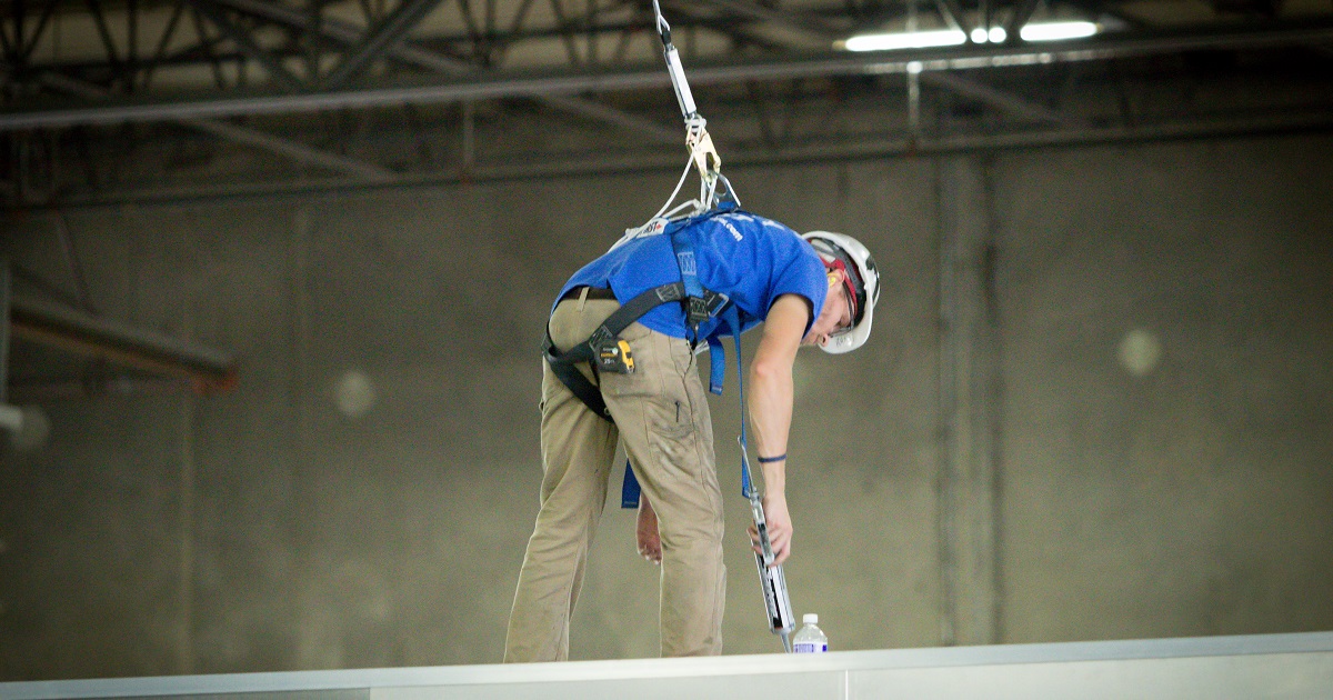 Employee Uses Fall Protection Lifeline